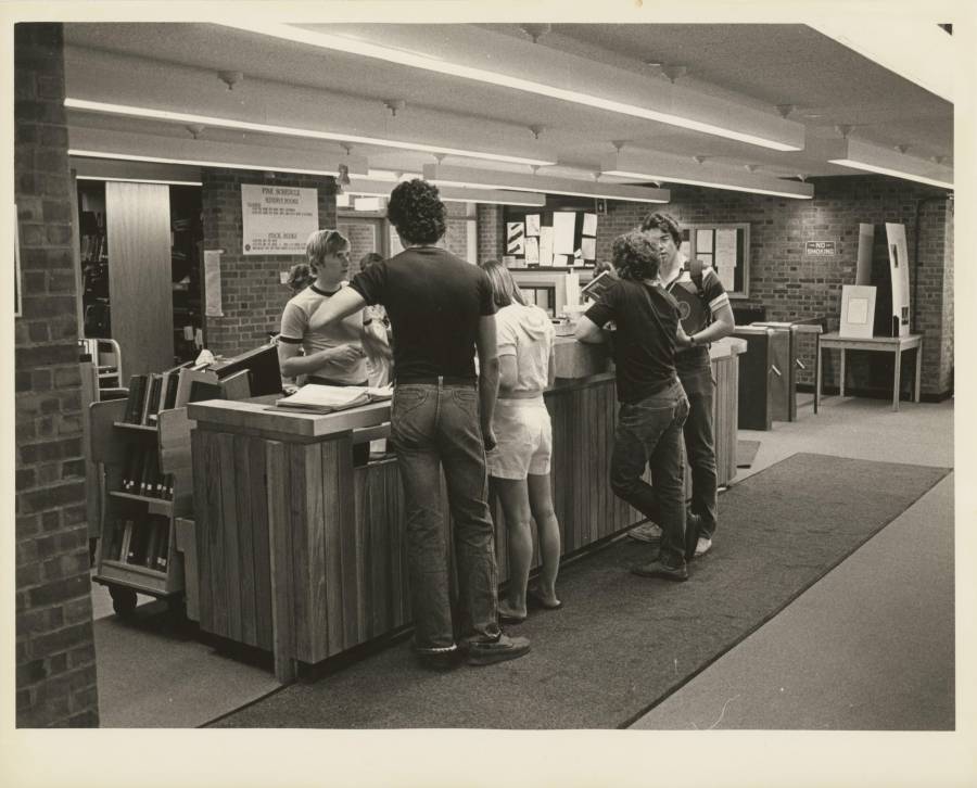 Title: Students at desk, Raether Library (Trinity College, Hartford...